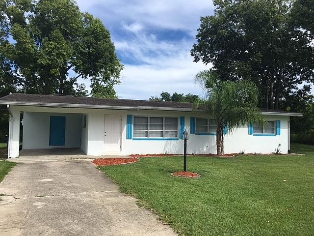 Front View Ranch Home with Carport