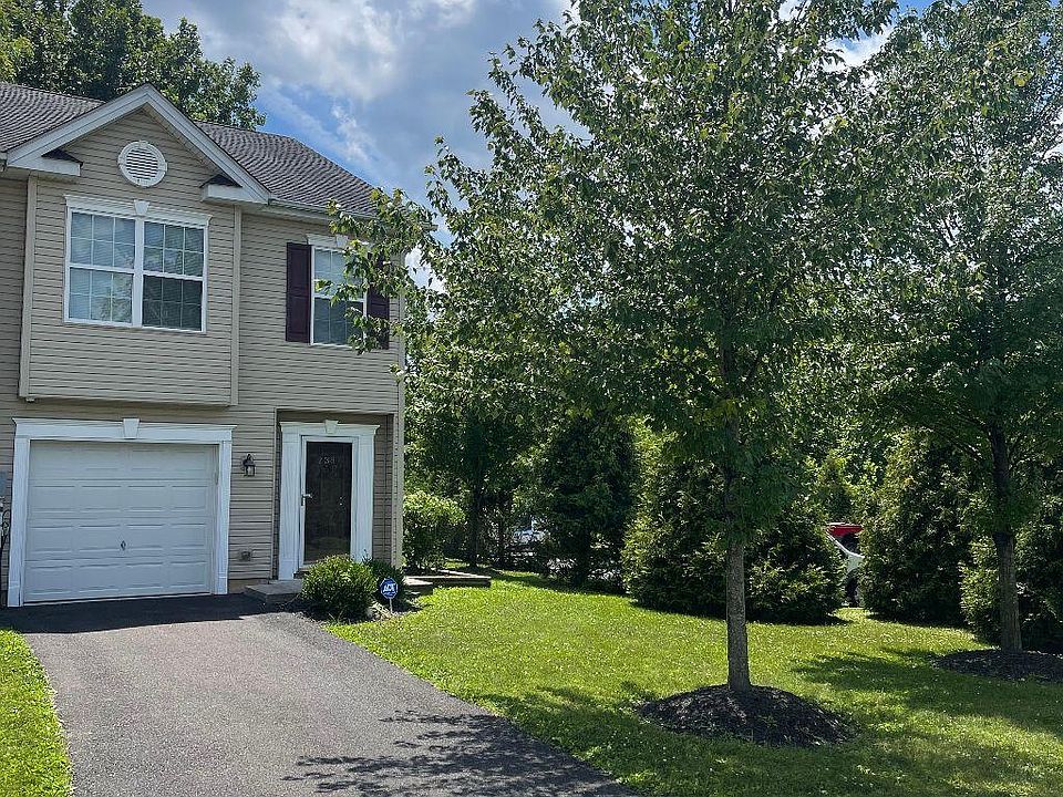 Front of home showing driveway to garage