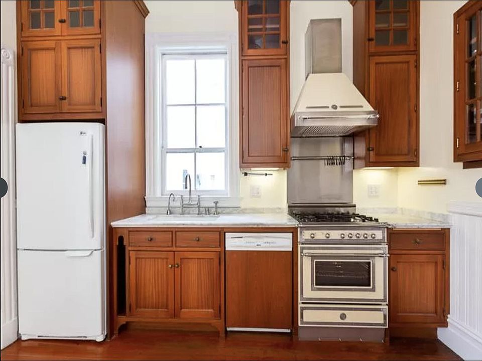Kitchen with granite counter tops, gas range stove, dishwasher, garbage disposal.