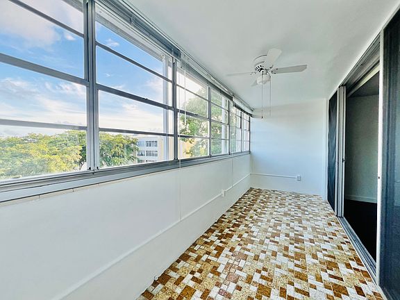 Enclosed balcony/den with lake view.