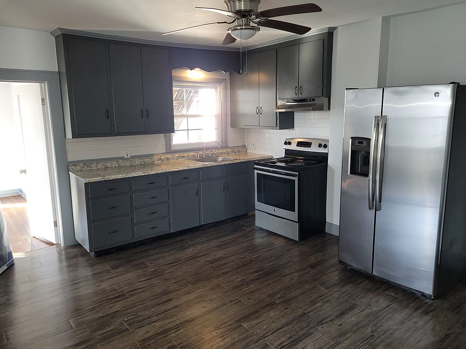 Kitchen with stainless steel appliances. Great large side by side refrigerator and freezer. Window over sink.