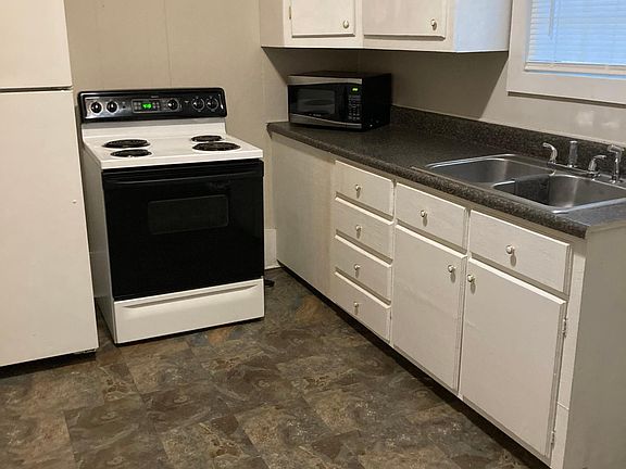 Plenty of cabinet space with refrigerator and stove included.