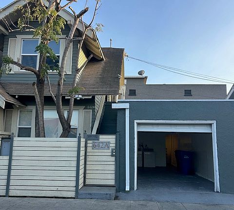 Front gate entrance + open garage