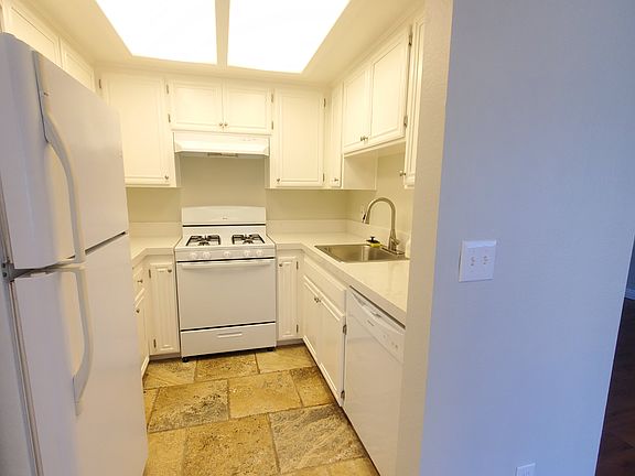 New kitchen with counter tops, appliances, new deep stainless steel sink and pull down faucet