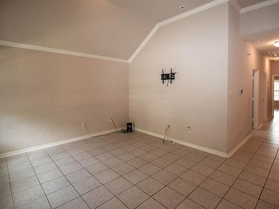 open door, Living room and no carpet in this home.