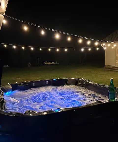 Backyard w/ Hot tub and lighting