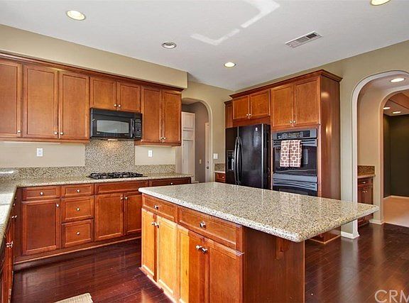 Kitchen and butler's pantry into formal dining room. Mud room to the back