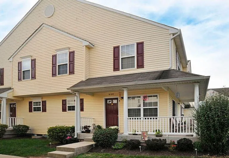 Two story townhouse with finished basement and wrap around porch
