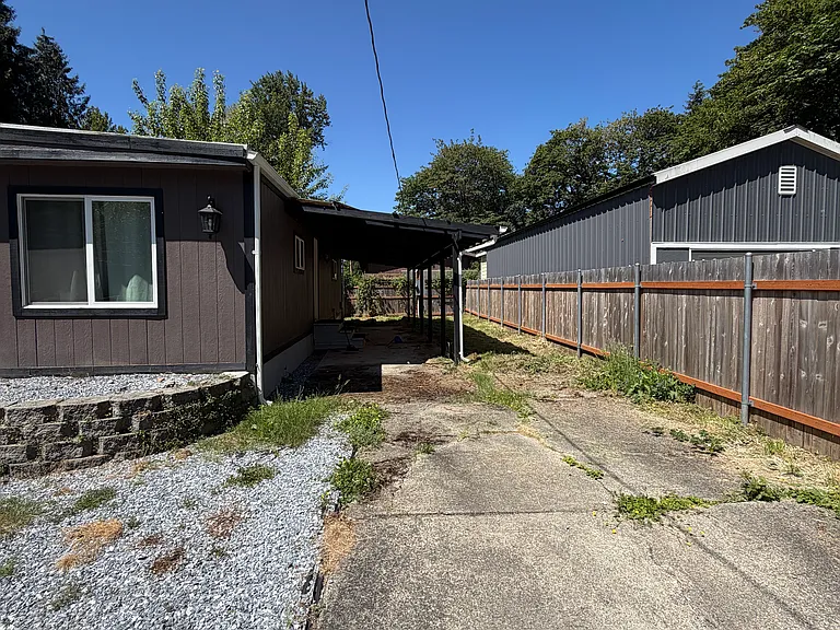 Side yard with second covered porch and RV parking/extra parking