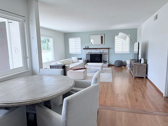 Dining and kitchen seamlessly blend into great room.