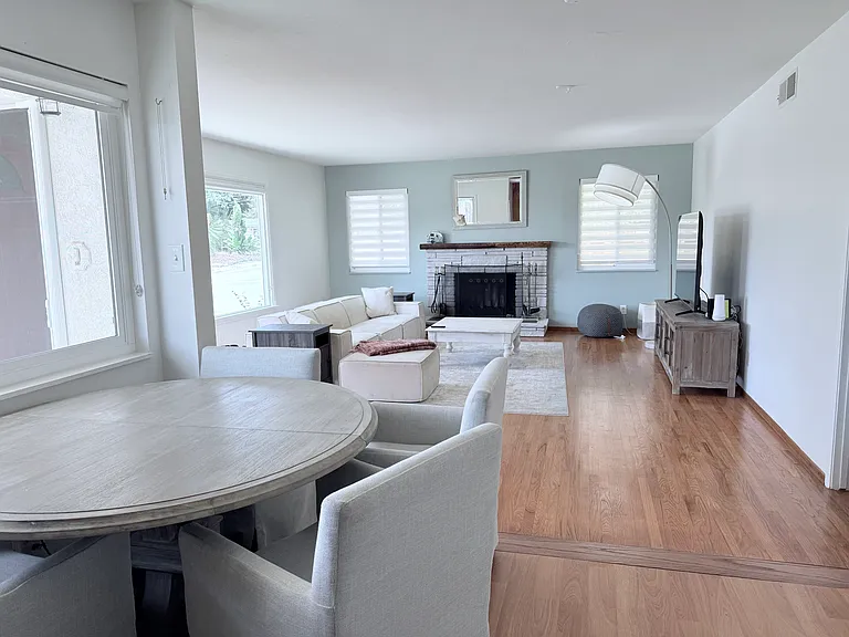 Dining and kitchen seamlessly blend into great room.