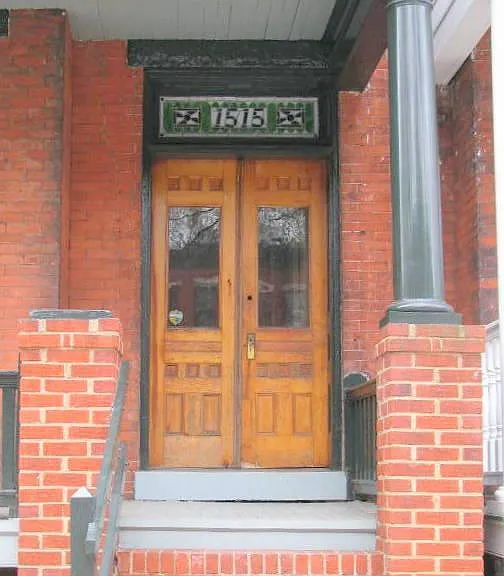 Enter the original 7ft tall doors into a foyer. Original doors from 1890 when house was built.