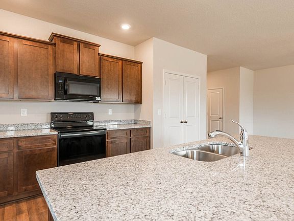 This chef-ready kitchen features granite countertops