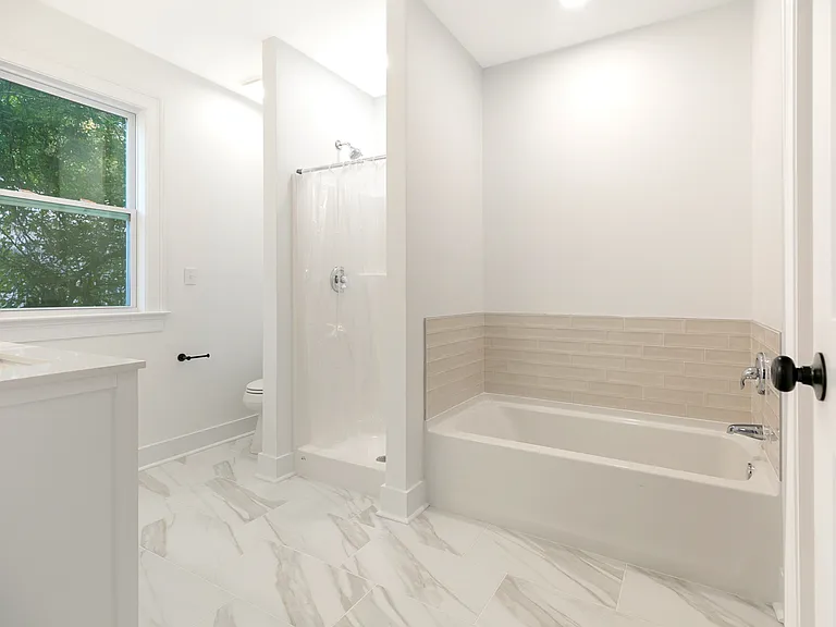 New master bathroom with walk-in closet.