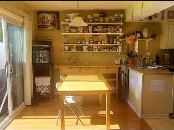 View of the dining room and partially the kitchen from the living room.
