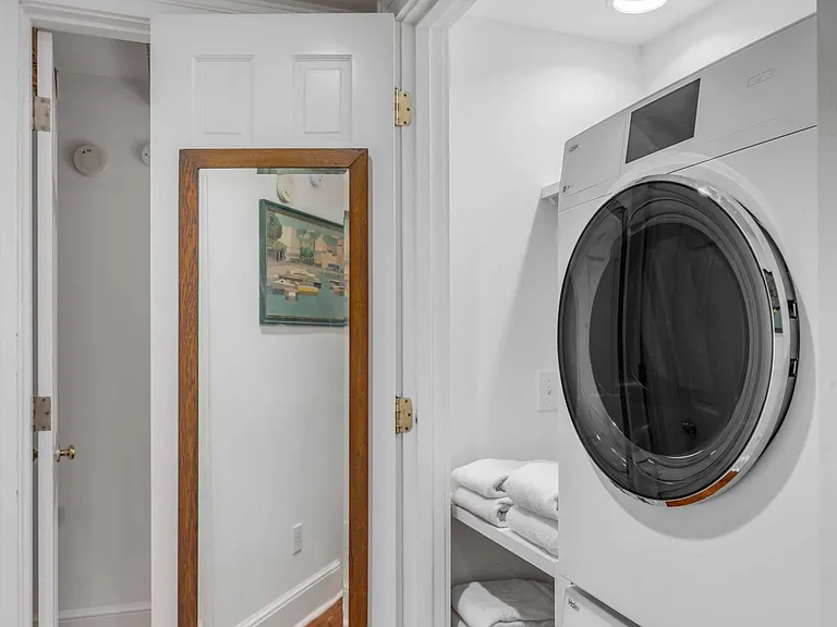 Laundry station featuring Washer & Dryer by Haier.