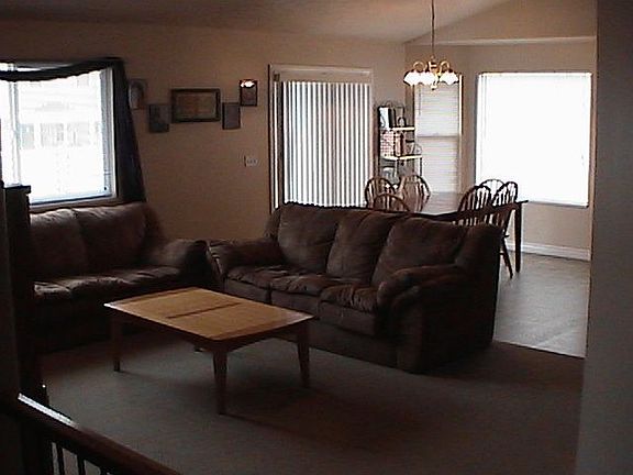 Open living, dining, and kitchen.