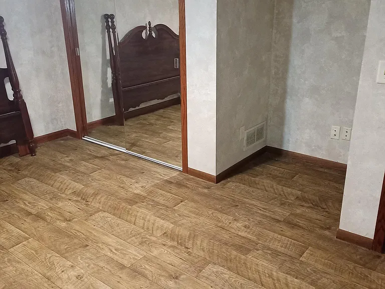 Bedroom showing the large closet with mirrored doors, nook for TV, or dresser ( Photo taken before bed was put up)