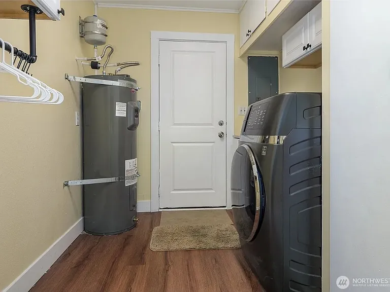 Separate laundry, door to backyard
