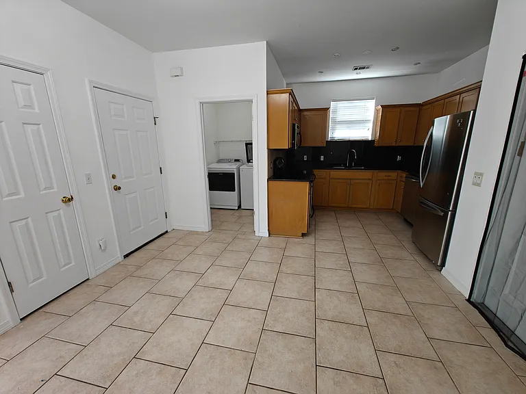 Kitchen, laundry room, access to garage and closet, backdoor