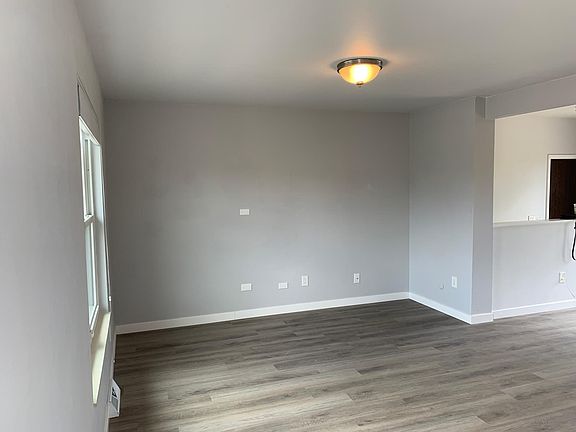 South-facing living room with multiple options to wall-mount a TV and hide the wires.