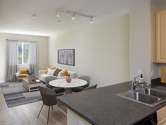 Kitchen, living, dining areas with hard surface flooring