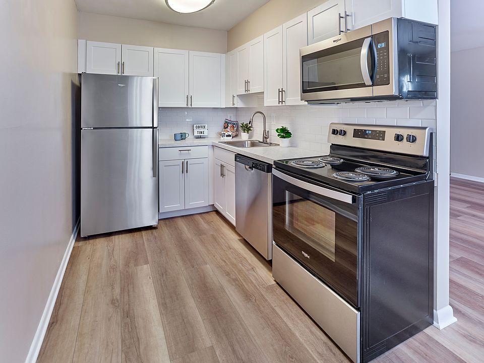 Contemporary kitchen with stainless steel appliances at Village Square.