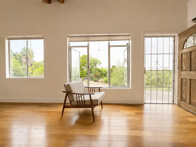 Living room window overlooking hilltop views