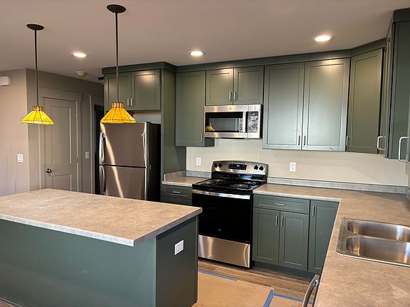 Beautiful Open Kitchen with Stainless Steel Appliances