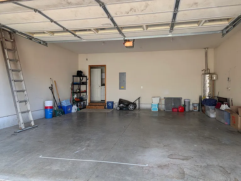 Oversized double garage that fits 2 vehicles plus plenty of remaining storage