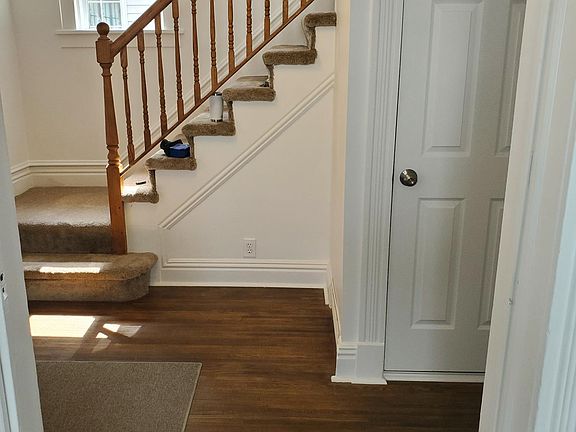 Front Foyer, Hall Closet and stairs to second floor, pocket door on left works