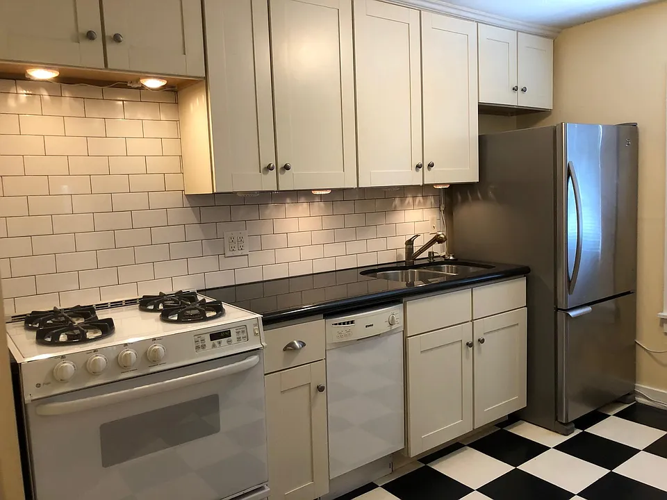 Appliances include range, dishwasher and new refrigerator. Undercounter lighting.