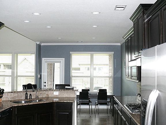 What a kitchen! Beautiful granite countertops, and stainless appliances.