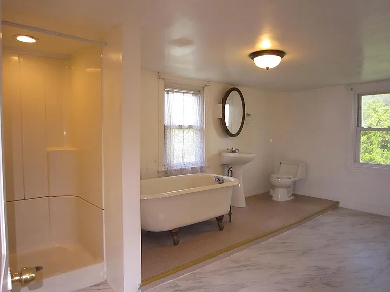 Extra large bathroom with shower and bathtub