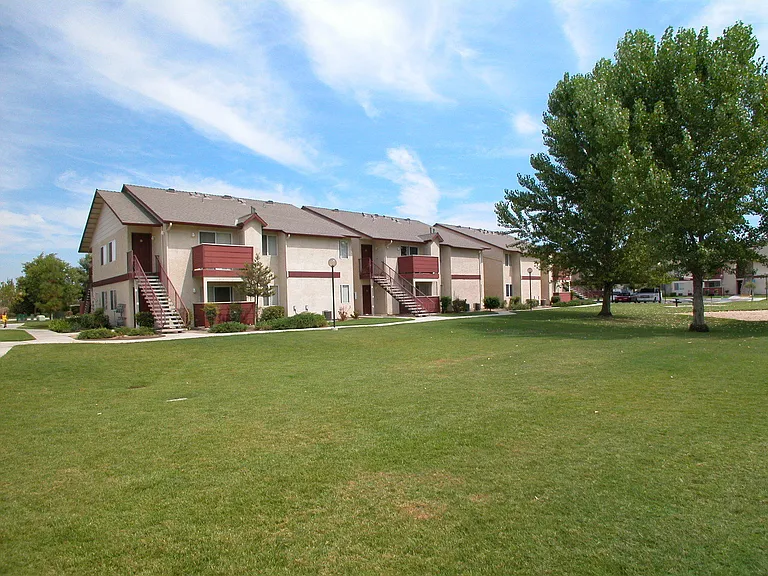 Building Exterior View From Grass Area