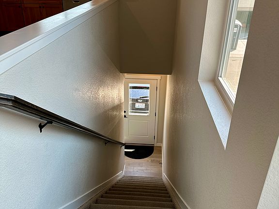 View from the top of the stairs to the front door.