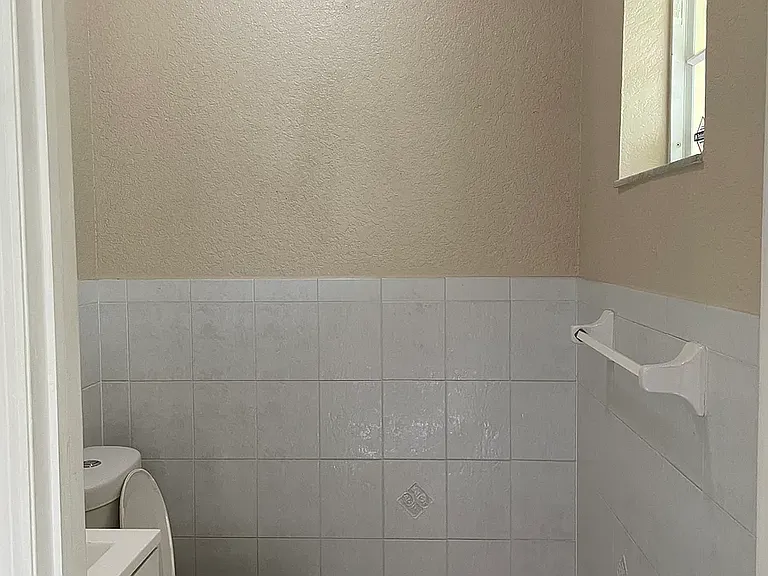 The powder room is near the entrance.