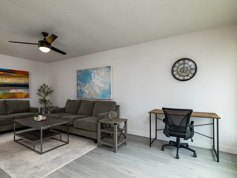 Spacious living room with plenty of seating for friends and family.