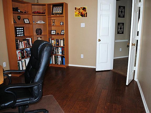 Tucked behind the doors to the left of the entry is the office, where you can work from home or catch up on personal business.