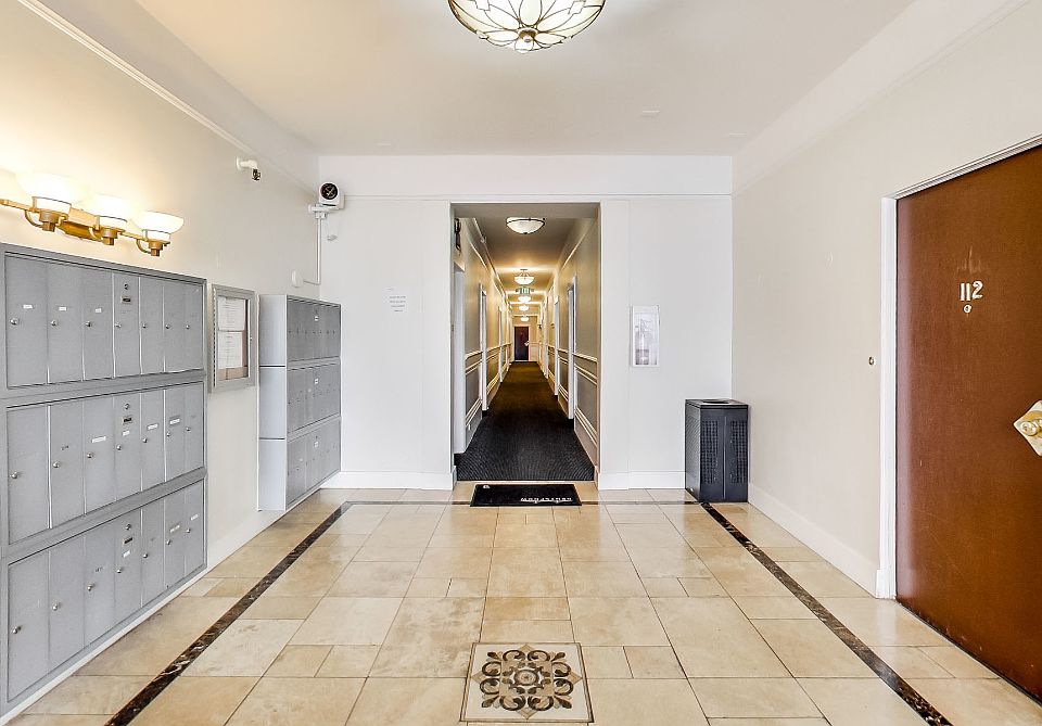 Apartment foyer with stylish decor and mailboxes