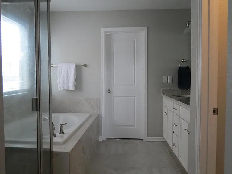 Primary Bath: Seperate shower, deep tub, dual sinks, water closet