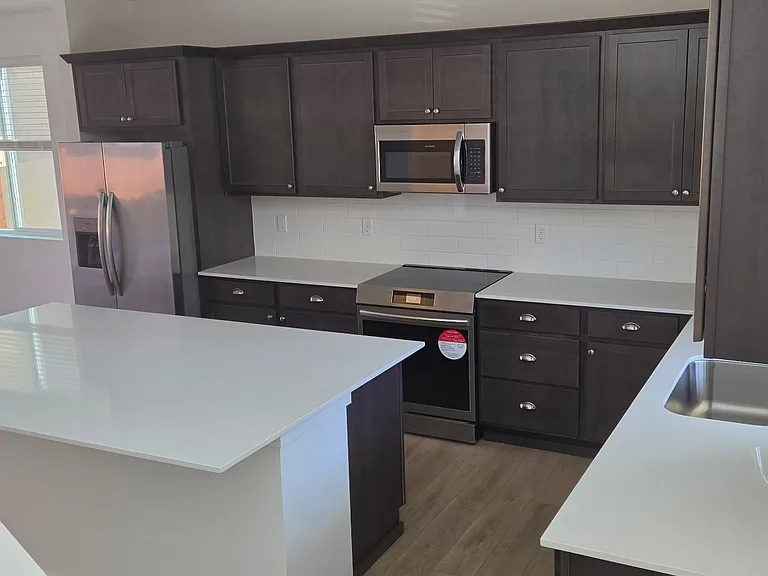 Brand new stainless steal appliances with lots of countertop space.