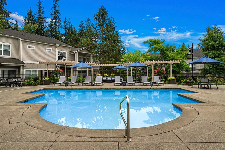 Large pool deck with lounge chairs