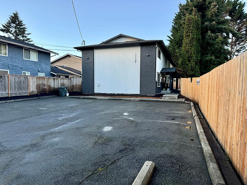 Parking lot with dedicated parking for each tenant.