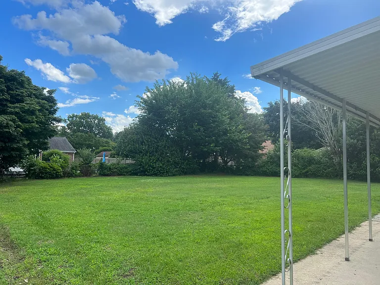 Covered patio over looking the tranquil back yard