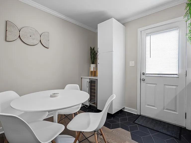 Back door leads to a 300 square foot deck and patio furniture. Enjoy the city skyline, sunsets or the tranquil park setting we back up to.