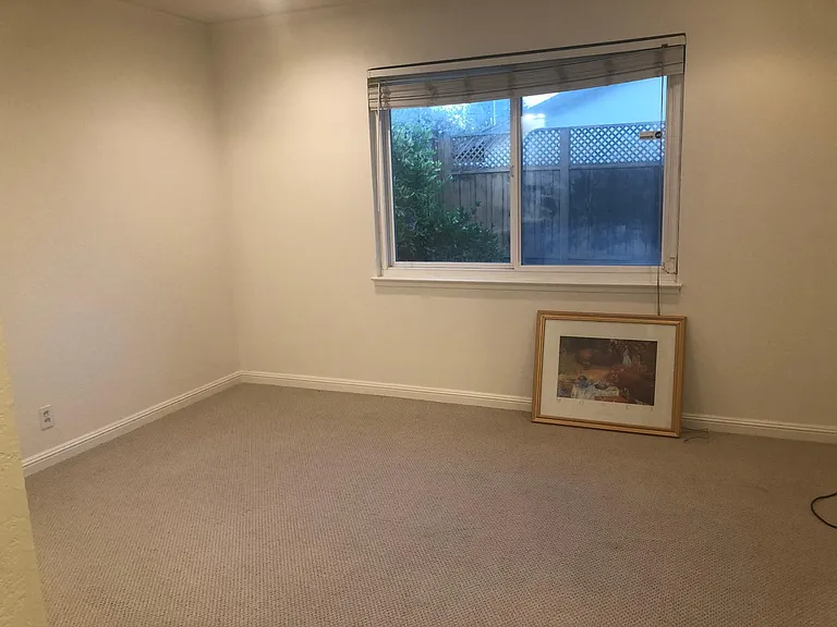 Master bedroom with a full bathroom, an extra large window, new carpet and fresh wall paint with a double mirror sliding doors closet