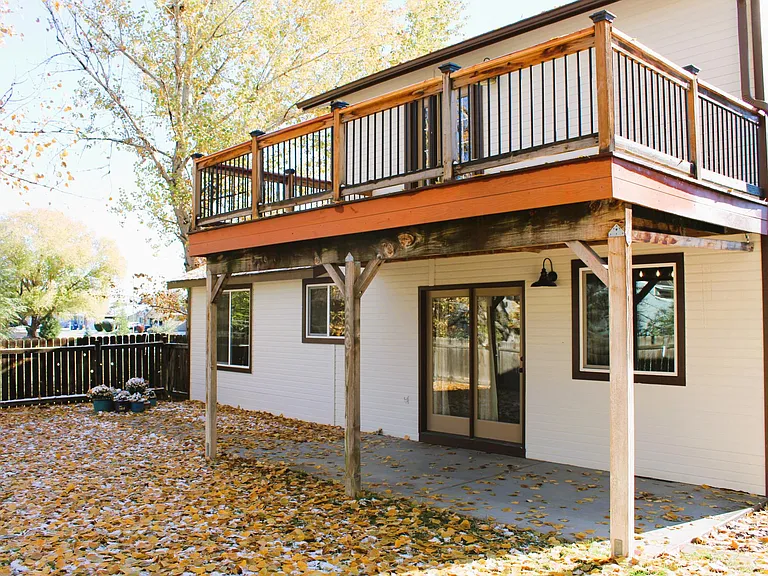 Back of house - lower patio and upper deck