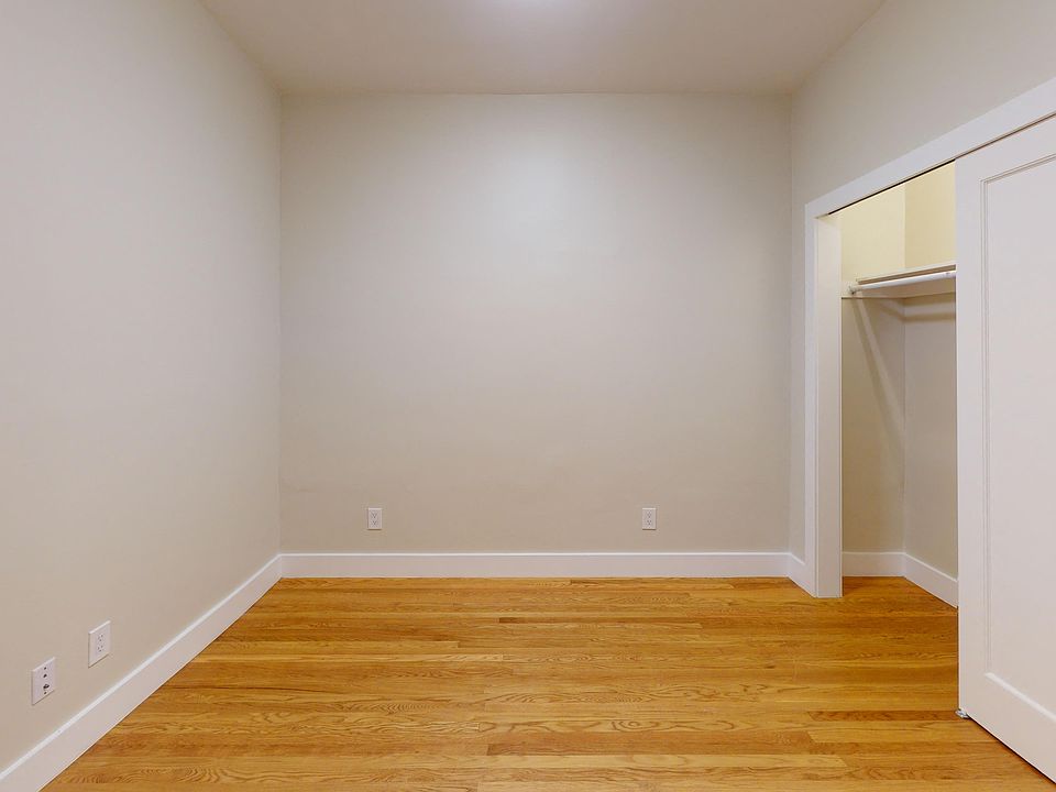 Bedroom with closet door on the side