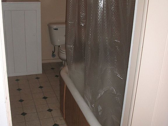 Newly refreshed bathroom w/vintage tub.